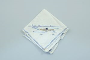Image: Figure kayaking, one of a set of 4 embroidered napkins, each with different outdoor activity 